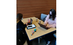 Seniors Reese Wendall and Anali Anderson drinking Starbucks and completing homework before class. 