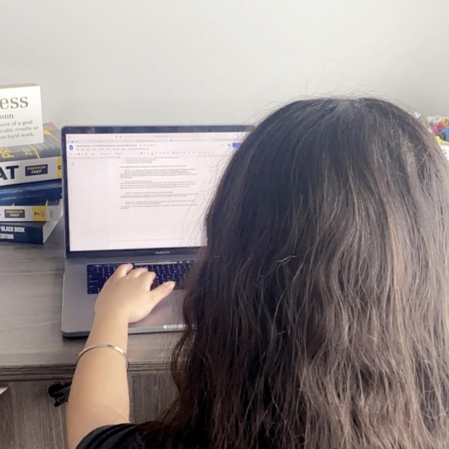 Junior Jessica Singh completes a class assignment from home. On Feb. 5 all Hybrid A students participated in virtual learning from home due to a snow day. 