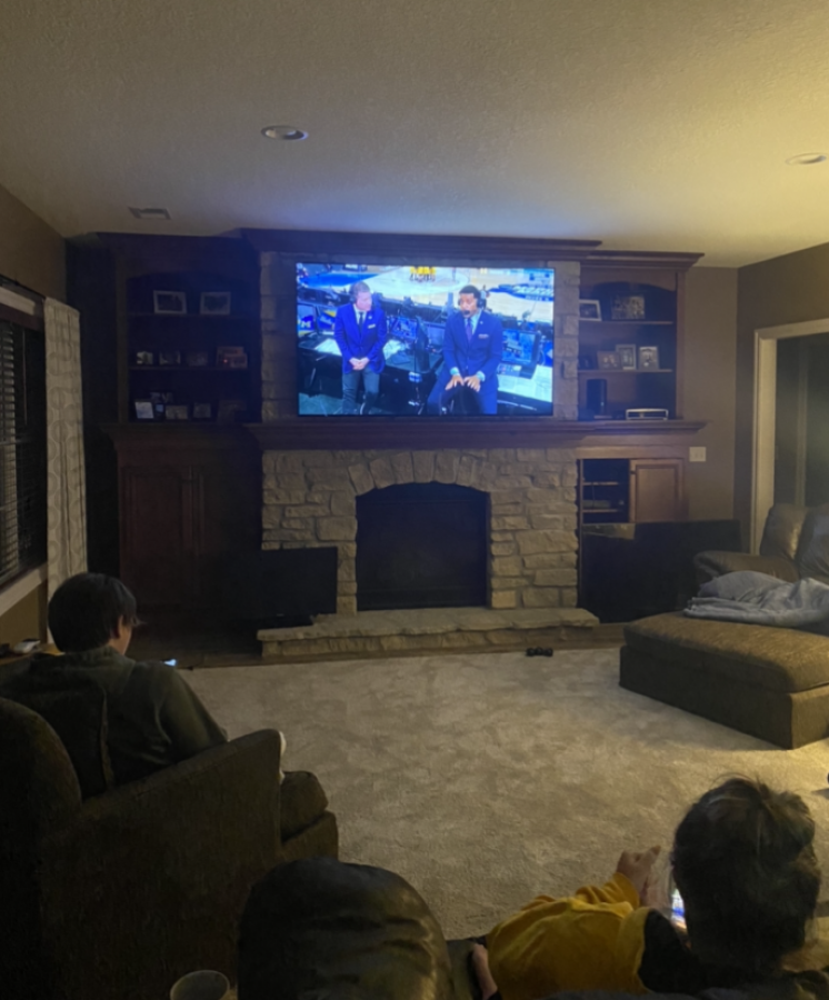 College student Creighton Clausen and senior Lily Barrett watch the NCAA tournament during the sweet 16 round.
