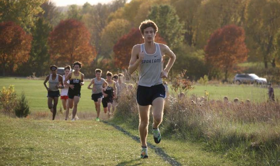 Senior Kole Sommer runs in a cross country meet for the Pleasant Valley Spartans.