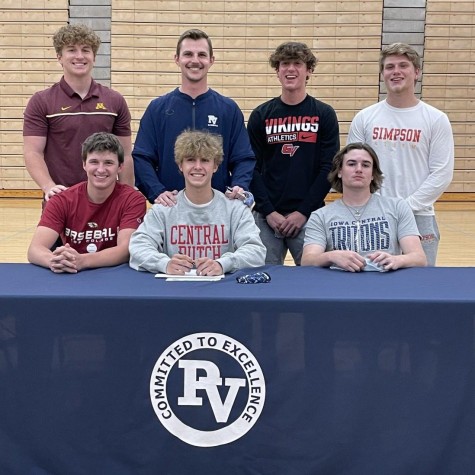 Coach Derek Stecklein proudly stands with seniors from PVs  baseball team who have committed to play at the collegiate level.
