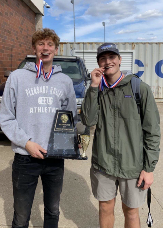 Seniors Kole Sommer and Alex Melvin show off their silver medals after winning second place at the local trebuchet competition held at Bettendorf High School. 