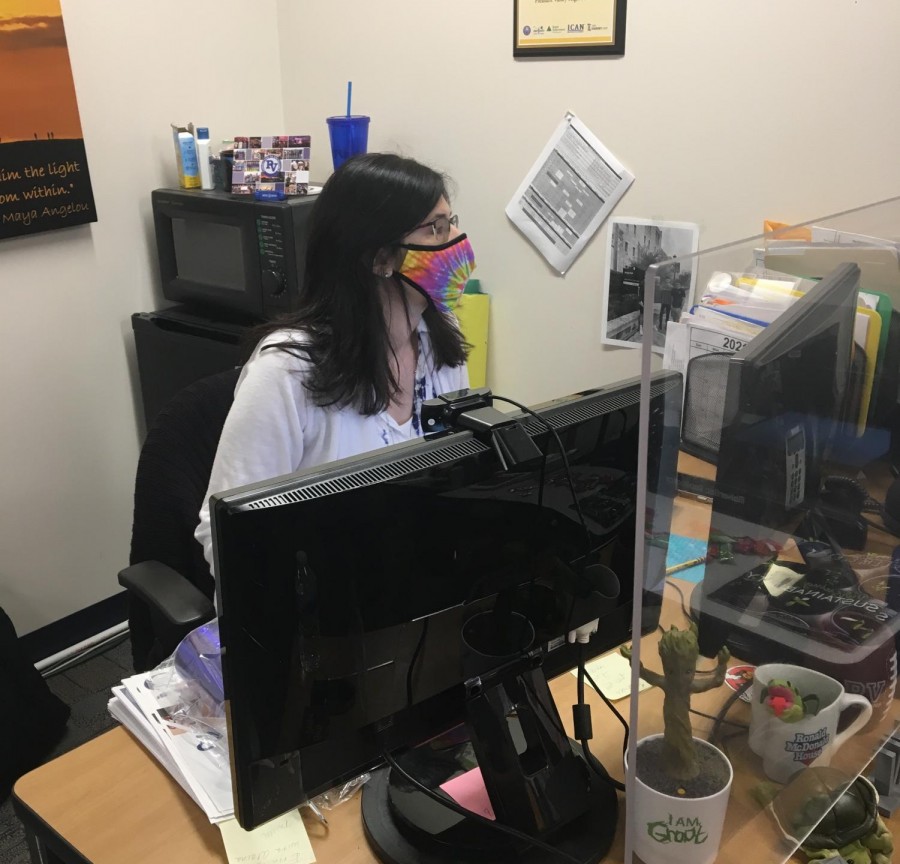 Janene Murphy works at her computer to create a bingo game, which can involve both her in person and online students.