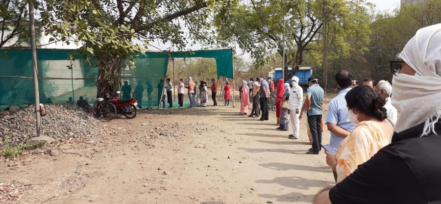 Indians wait in a long line at a vaccination site in Nagpur, India. Citizens are desperate to receive their doses of Covishield as the second wave of the pandemic consumes the country.
