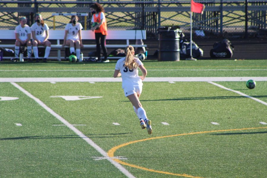 Morgan Russmann playing in a soccer game at Bettendorf High School