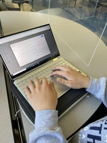 Junior Ryan Groenenboom checks to make sure his Google Drive is restricted, preventing other students from taking his work.