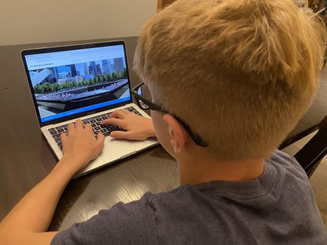8th grade student Zach Zuiderveen looks at the official 9/11 Memorial & Museum Website after learning about it in Mrs. Hall’s class.