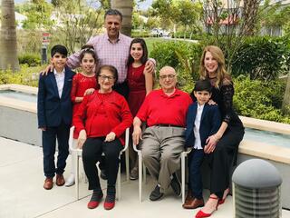 A photo of Rahila Amany, an Afghan refugee from Kabul, and her family. She has four grandchildren who attend PV and a scholarship for her loving nature.