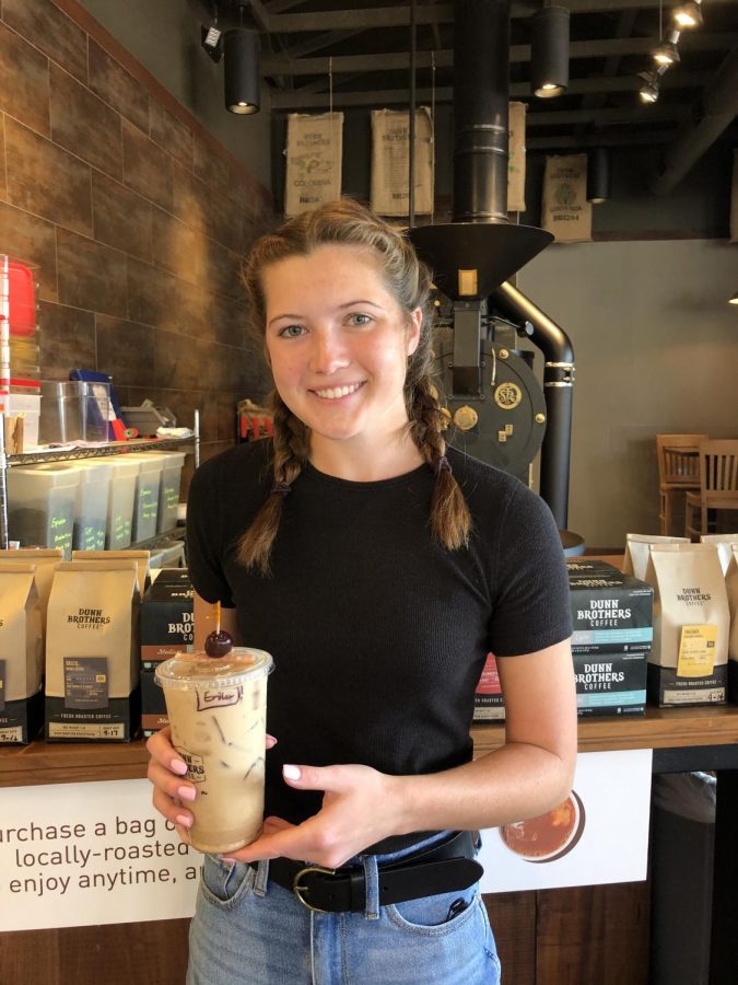 Pleasant Valley senior and Dunn Brothers employee, Erika Holmberg, holds a classic fall drink: the old fashioned latte.