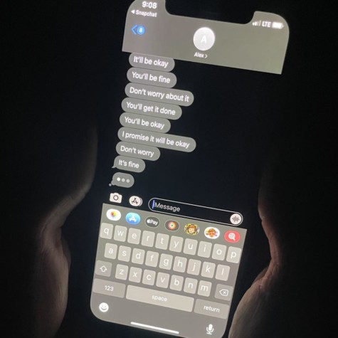 A student holds their phone with text messages representing toxic positivity on October 11, 2021.