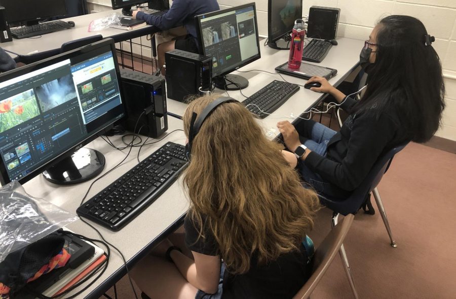 Katie Sulgrove (left) and Nehal Agrawal (right) are creating a practice video with Adobe Premiere to familiarize themselves with the software.