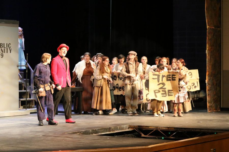 “Urinetown” cast rehearses for the show.