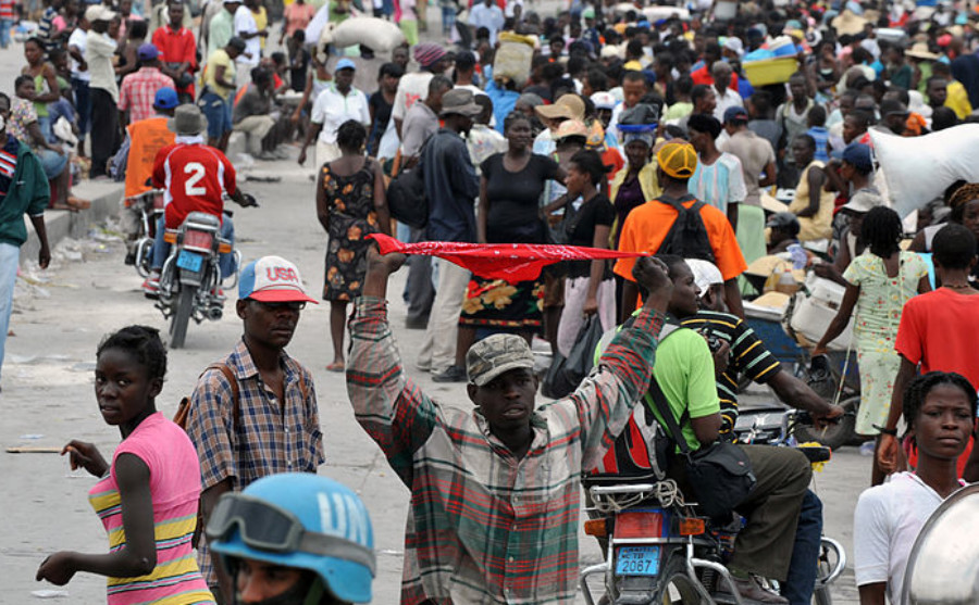A havoc filled street is flooded with Haitian migrants.
