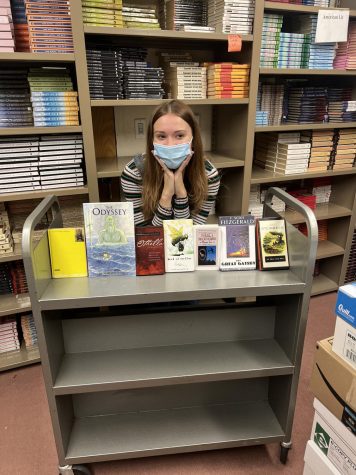  Josie Olderog poses with many books used in PVHS english curriculum.