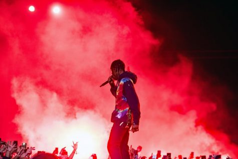 Travis Scott performs to a packed crowd with a massive spectacle.
