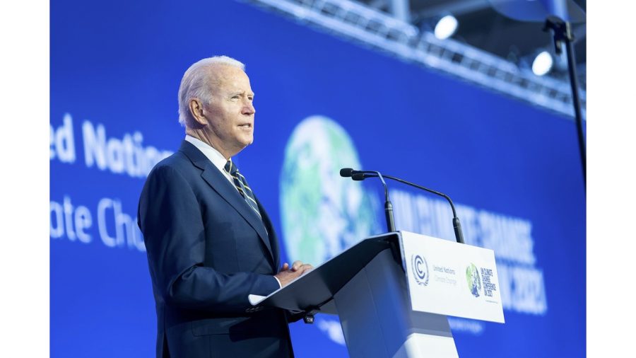 US President Joe Biden stands to speak at the opening ceremony for the UN COP26 Summit.