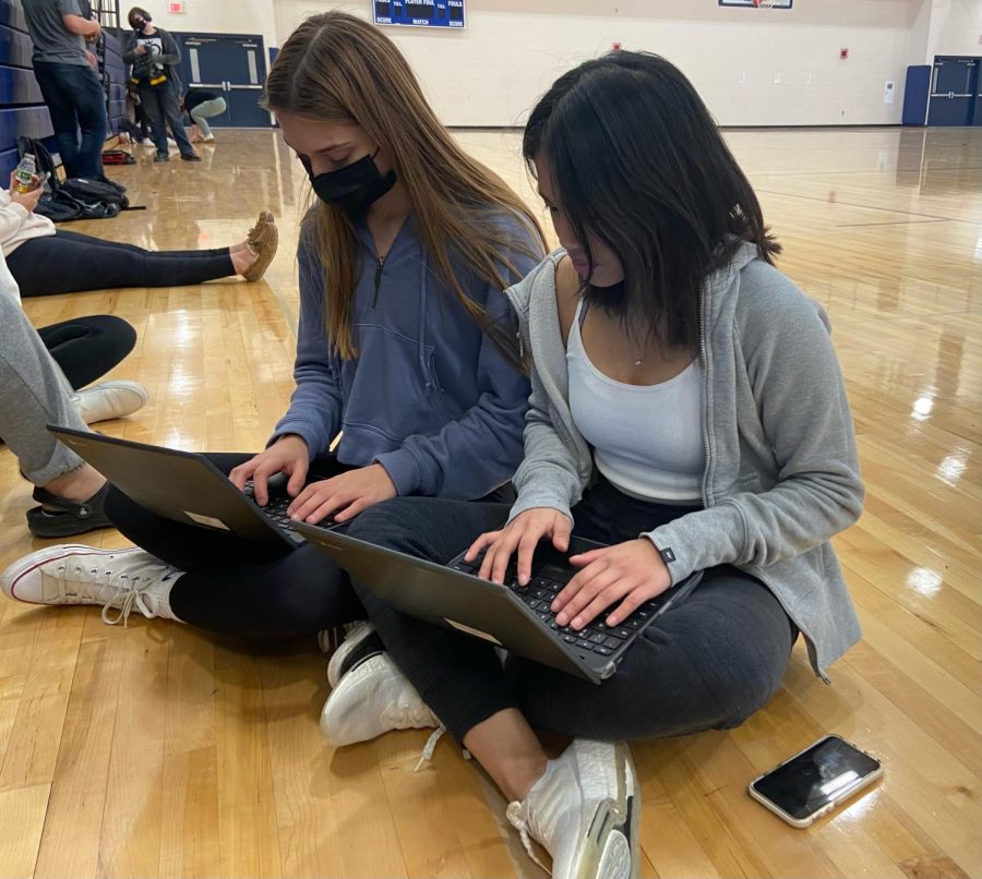 Seniors Ela Ersan and Eyah Gambong (pictured left to right) work on the processes of college admissions, something they have anticipated doing from a young age. 