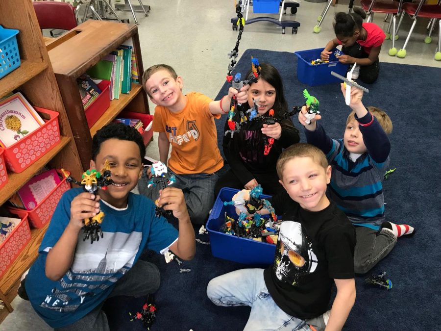 A group of students at Butterworth Elementary School play with a Lego set during indoor recess. 
