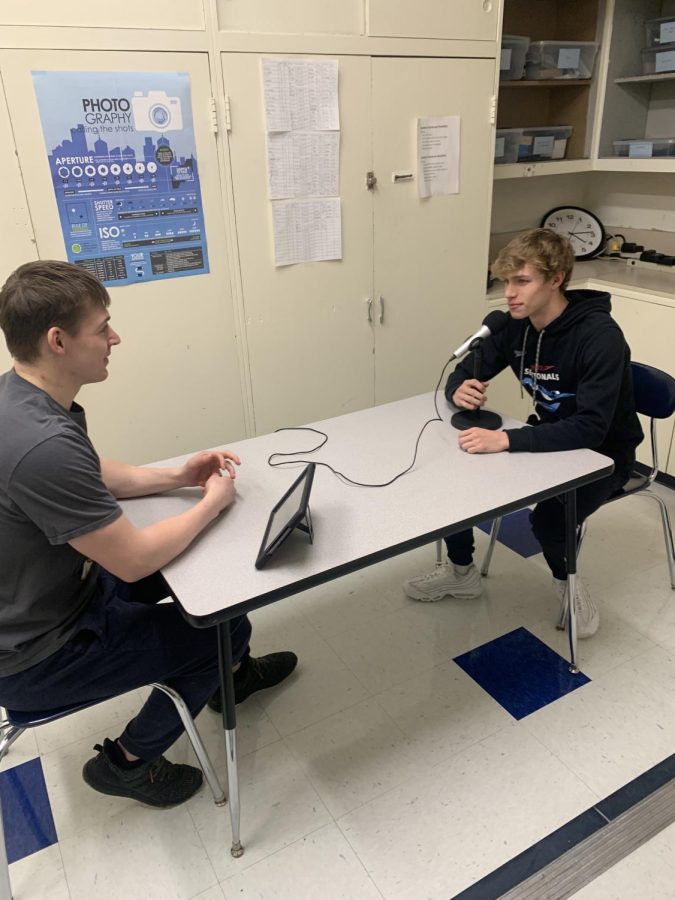 Two PV students prepare to record a podcast together.