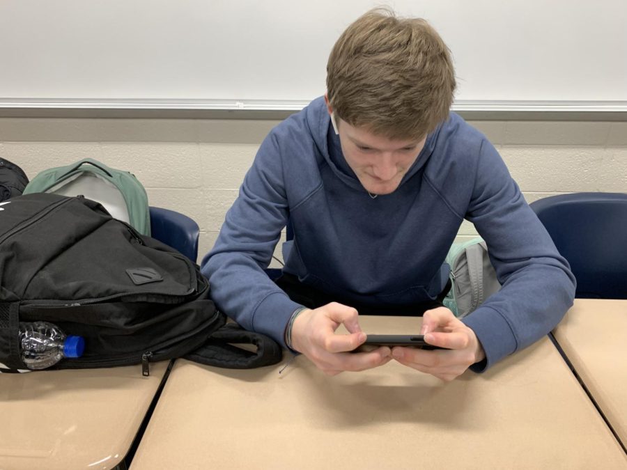 Senior Owen Gannaway catches up on his favorite 90’s series in class.