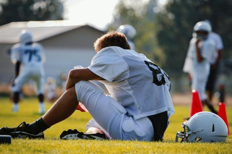 Athlete takes a break during practice to recover. 