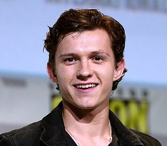 Lead actor Tom Holland smiles for the camera.