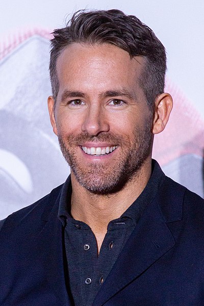 Star Ryan Reynolds smiles for camera.