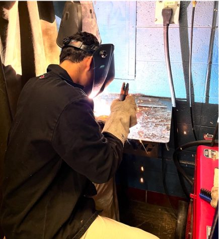 Pleasant Valley Student practicing welding