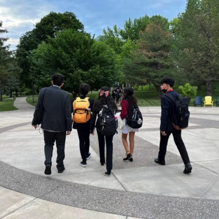 NHI participants walk across the Augustana College campus to attend a mock legislative session. 