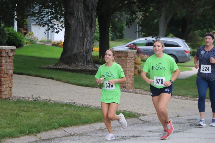 Seniors Reagan Glaus and Katie Delcorso keeping a steady pace through the two-mile mark.