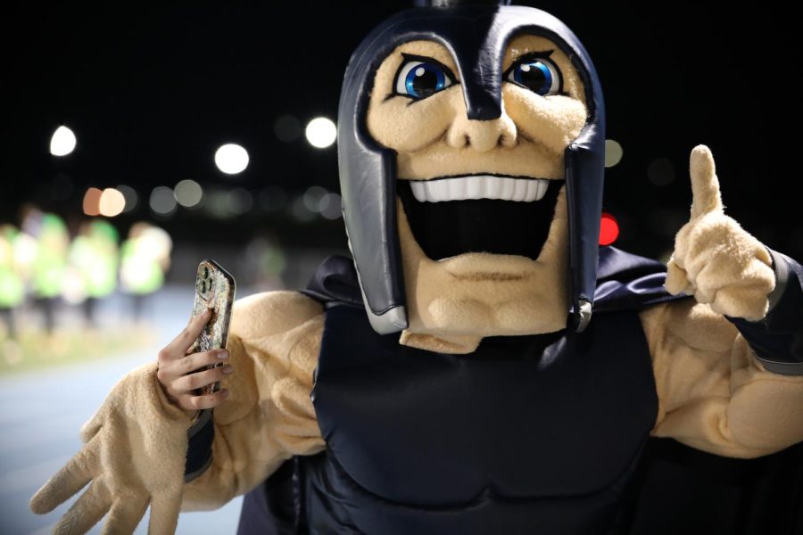 Sparty, Pleasant Valley’s mascot, celebrates after Pleasant Valley scores a touchdown.  
