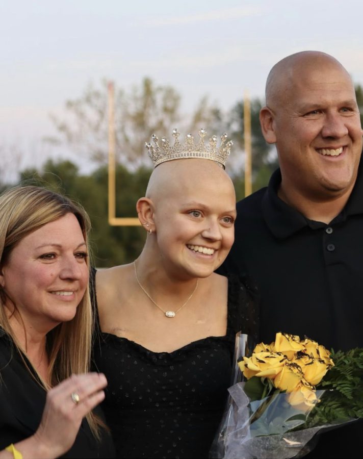 Charly Erpelding crowned Homecoming Queen her senior year at Bettendorf High School, alongside her parents Tara and Andy Erpelding. 