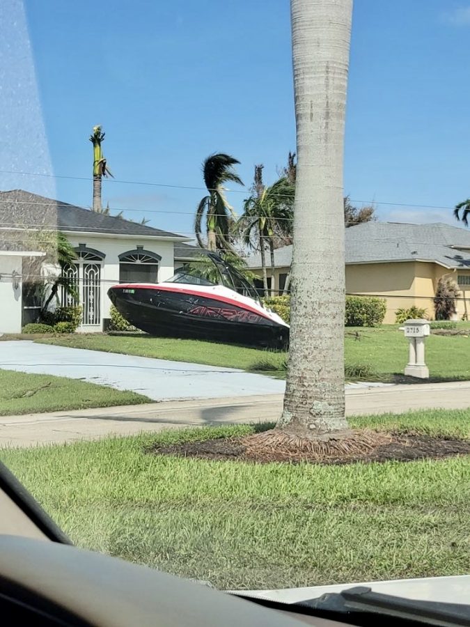 A boat ended up in someone’s yard as a result of severe flooding and damage post-hurricane Ian.
