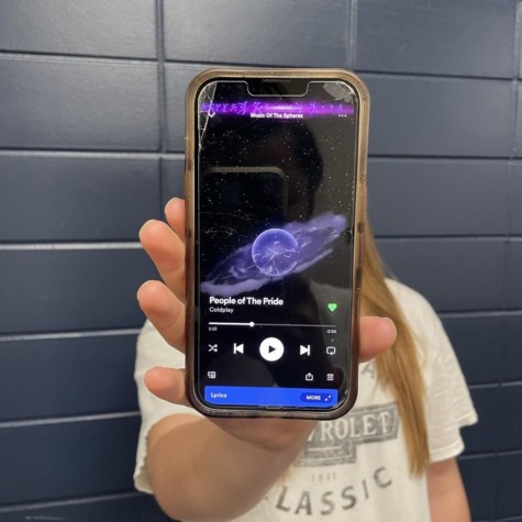 Senior Libby Kamp poses with Spotify open to “Power of the People” by Coldplay. The song features the message that everyone, regardless of race, gender or sexuality, has the right to be themselves. 