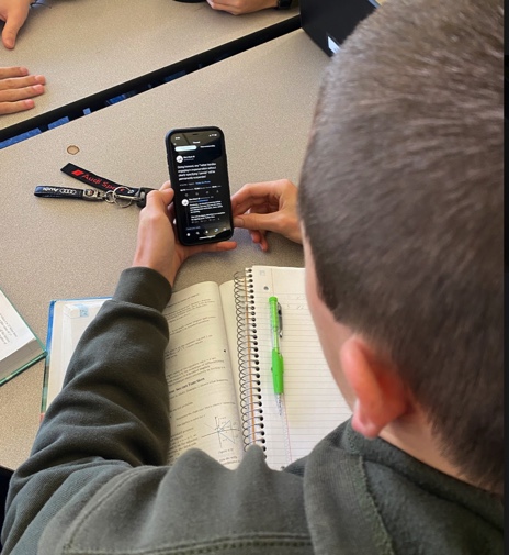 Senior Oscar Olsen looks at a tweet from Elon Musk during study hall. Olsen sees Musk’s purchase of twitter as a positive, and hopes to see political fairness on the platform.