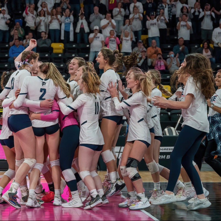 The Pleasant Valley volleyball team celebrates after defeating Waukee Northwest in the Class 5A State Semifinals.