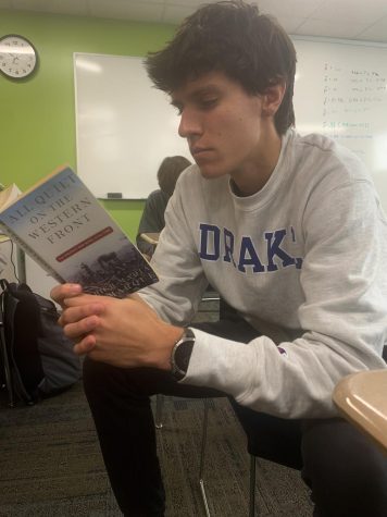 Senior Jacob Mumey reads All Quiet on the Western Front which was recently adapted into a film by Netflix in 2022