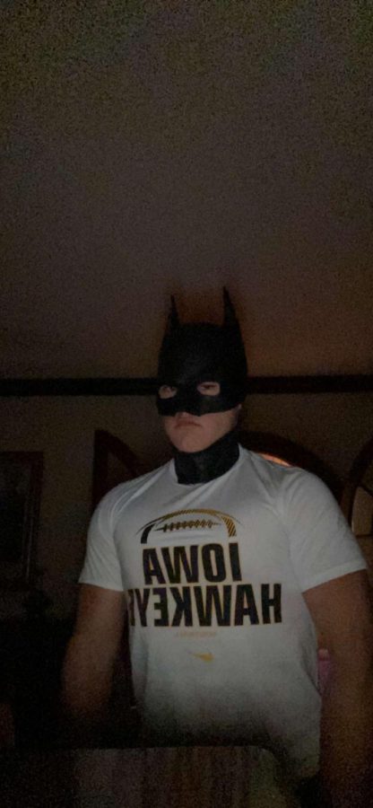 The Batman (2022) is seen protecting the city streets, lurking in the shadows.