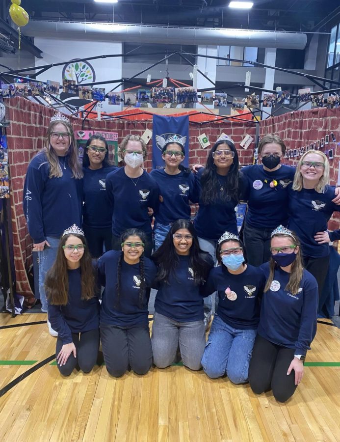 The Quad Cities only all-girl robotics team, Team 12863 Flourish and Bots, poses after their successful robotics competition.  