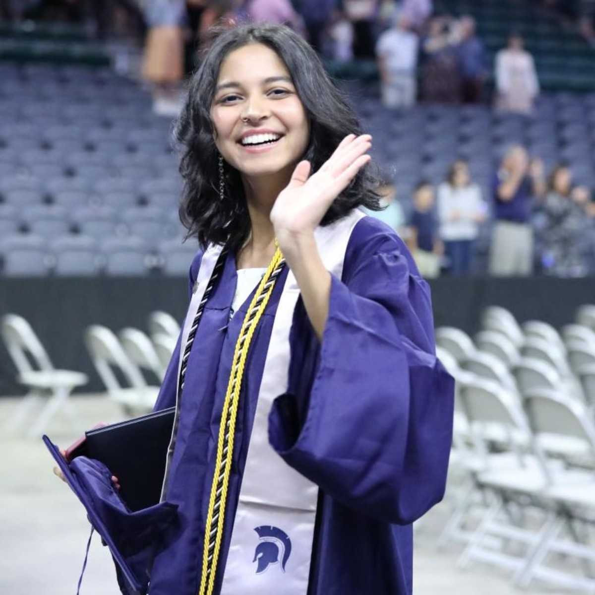 PV graduate Shobini Iyer exits the graduation ceremony after delivering her speech, High school is like writing a story.