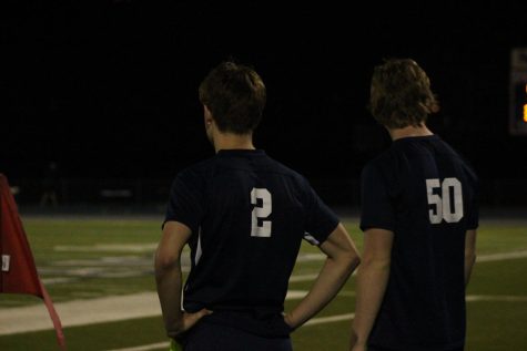 Senior Cael Stewart (2) and Junior Johnny Zeigelbein (50) waiting to be subbed in, April 13, 2023.