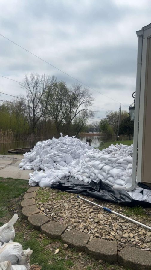 A wall of sandbags keeps the water out of a home in the Pleasant Valley district. 
