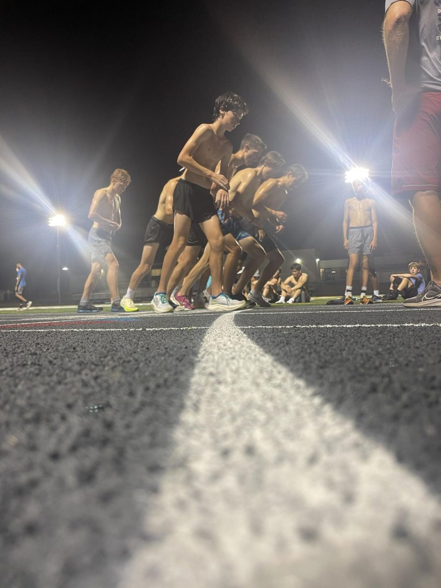 Cross Country athletes running at night after practice was rescheduled. 

Photo credit to Nick Sacco