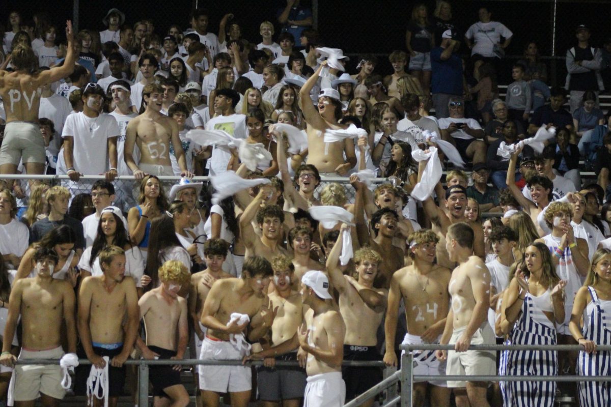 PV student section cheers during a home football game on Sept. 1. Often, rivals Bettendorf and Pleasant Valley Students trash talk the other team prior to the game on social media.
Photo Credit: Shield Staff