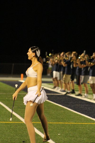 Junior Estelle Treiber twirls in front of the band at the PV-Kennedy football game.
