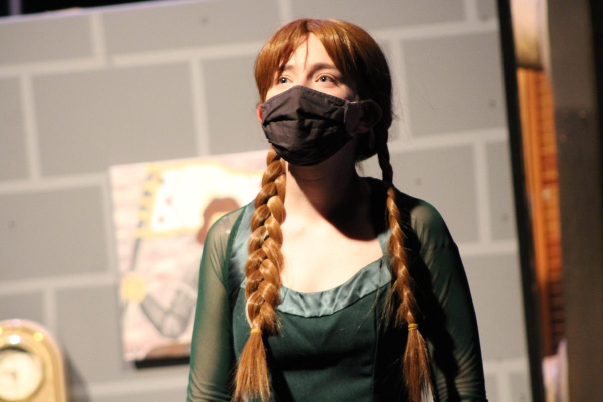 Pleasant Valley junior, Kailee McCaw playing Disney princess, Anna in “Frozen” musical in the Pleasant Valley High School black box. Photo Credit to Spartan Shield
