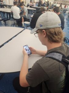 Senior Abram Giese coming across an advertisement while scrolling on the social media platform Tik Tok