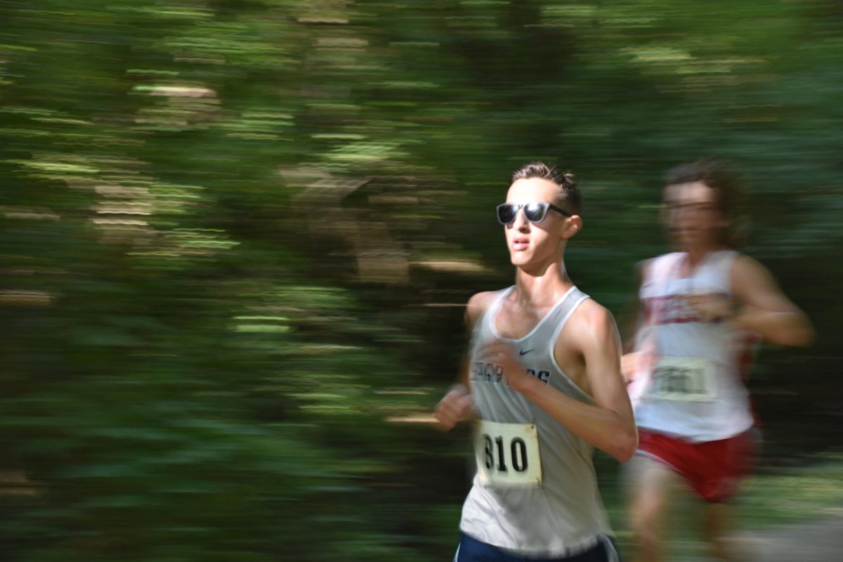 Senior Captain Tyler Nels runs for his last home race.
