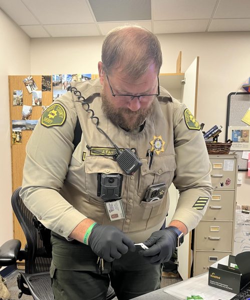 Deputy Fah testing for THC in a weed pen found on a student on campus. 
