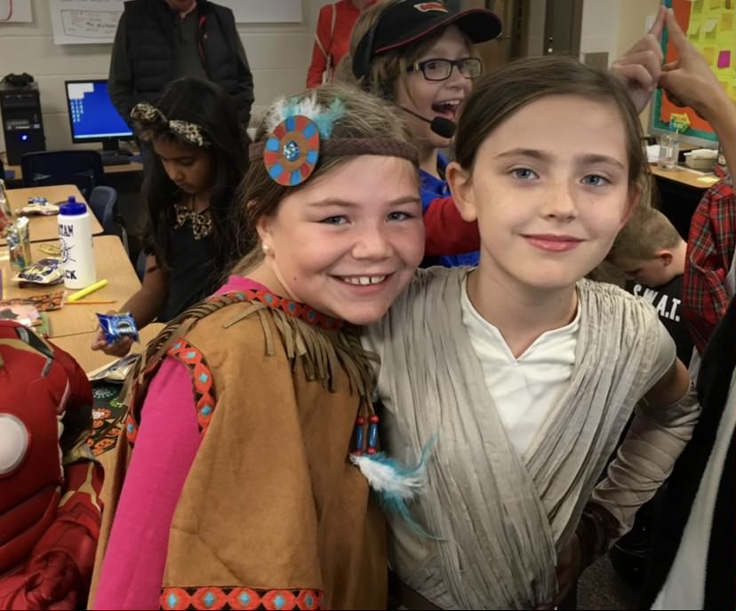 Elementary school students dress up for Halloween. One student dressed up as Pocahontas despite a lack of connection to Native American culture.